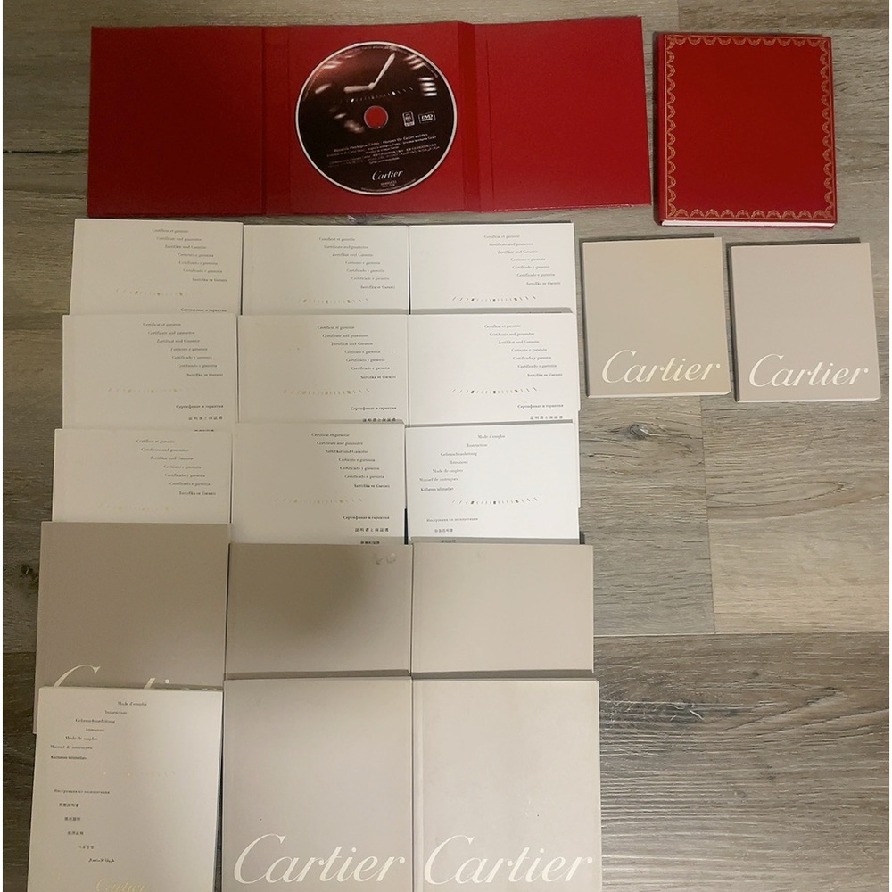 Bundles Cartier watch booklets ( signed certificates and instructions)